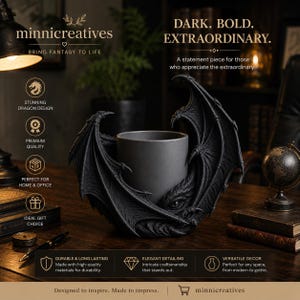 May include: A matte black cylindrical planter or vessel encased in a detailed dragon sculpture with large, textured wings wrapping around the sides. The dragon features a visible eye and intricate scale patterns, providing a dark aesthetic.