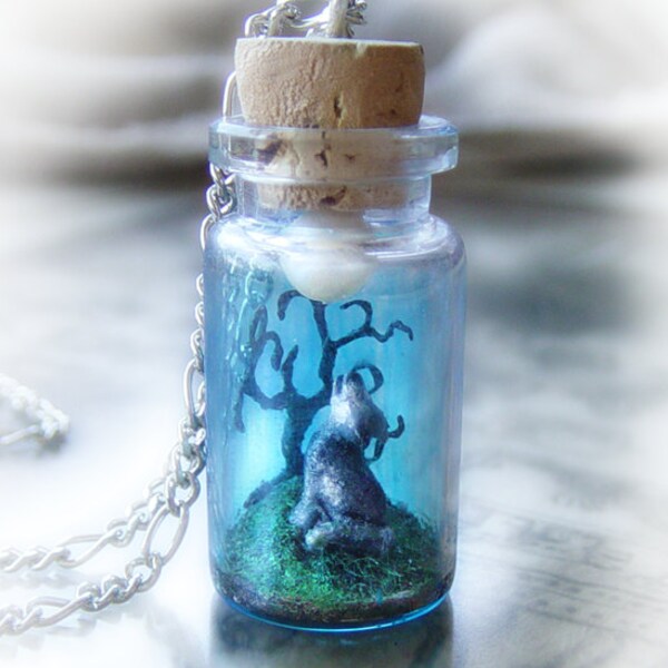 Wolf howling into the moonlight, clay scene bottle necklace