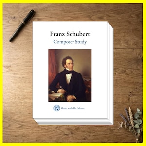 May include: A stack of white paper sheets featuring a portrait of Franz Schubert. The text reads Franz Schubert, Composer Study, and Music with Mr. Moore. A black pen is positioned to the left of the paper stack on a wooden surface.