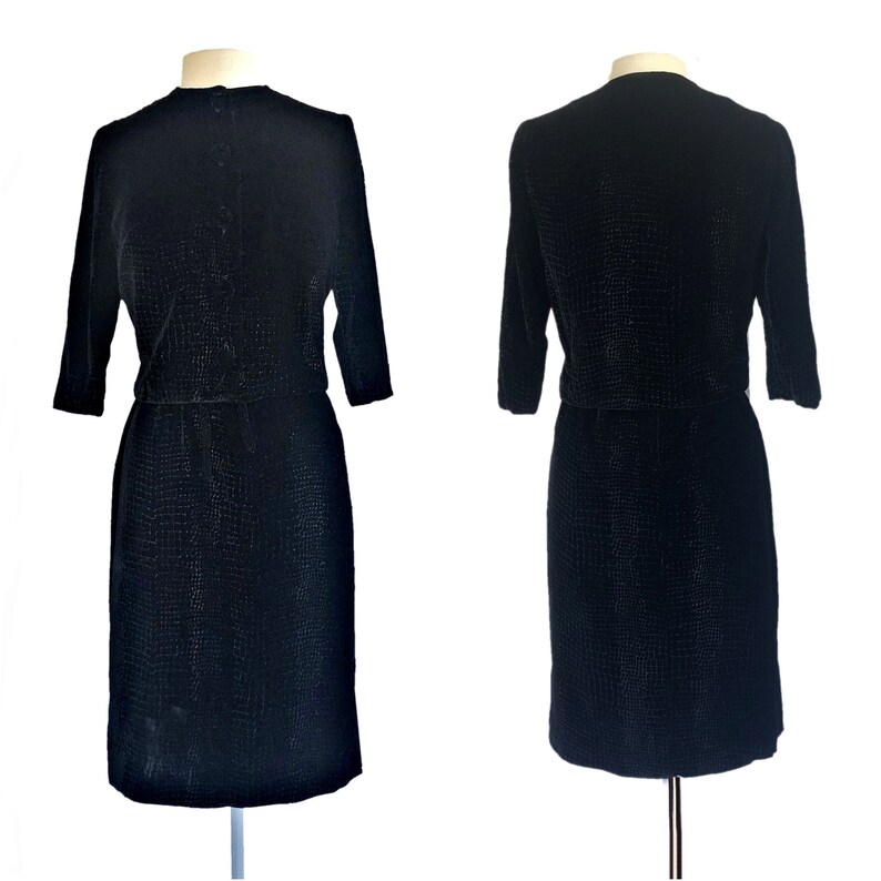 May include: A black velvet dress with a textured pattern. The dress has a fitted bodice and a skirt that falls to the knee. The dress has three-quarter sleeves.
