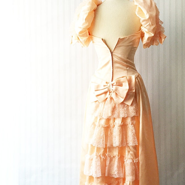 Vintage 80s party dress/ peach satin gown/ long pastel dress/ huge bow/ lace ruffles/ princess cut/ full skirt puffy sleeves cocktail dress