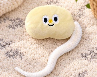Peluche a coda lunga: muso morbido ricamato, coda testurizzata (verde/crema)
