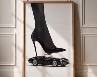 May include: A framed wall art print featuring a black stiletto high heel shoe with a red sole, positioned directly above a small black vintage convertible sports car. The composition is set against a plain white background, creating a sharp contrast.