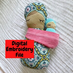 May include: Digital embroidery file for a mother and child doll pattern. The mother doll is wearing a teal and yellow patterned dress with a pink scarf. The child doll is wearing a teal dress. The text "Digital Embroidery File" is in red.