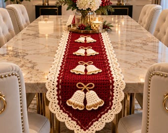 May include: A long, rectangular table runner featuring a deep red crocheted center with a scalloped cream-colored border. The runner is decorated with four pairs of cream-colored crocheted bells, each accented with gold thread trim and bows.