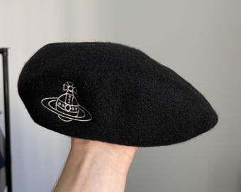 Vintage black beret embroidered orb planet logo