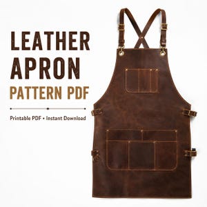 Puede incluir: Un delantal de cuero marrón oscuro con correas cruzadas ajustables con hebillas de metal, un bolsillo en el pecho y un bolsillo inferior grande con varios compartimentos. El texto LEATHER APRON PATTERN PDF Printable PDF Instant Download es visible.