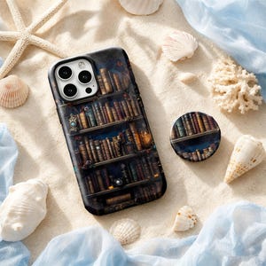 May include: A rectangular smartphone case and a circular phone grip, both featuring a dark, detailed print of a multi-tiered wooden bookshelf filled with numerous antique, leather-bound books in various shades of brown, gold, and deep blue.