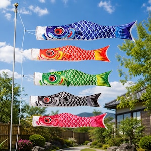May include: A vertical set of five colourful carp-shaped wind socks, known as koinobori, attached to a metal pole. The fish are blue, red, green, black, and pink, each featuring detailed scale patterns, large eyes, and flowing tail fins.
