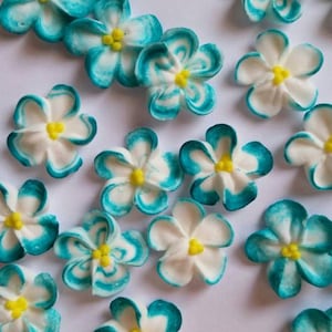 Made to order | 2 dozen teal-tipped white royal icing flowers | 3/4 inch | Sugar flowers | Edible cake decorations | Cupcake toppers