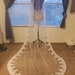 Cathedral, fingertip, elbow, shoulder wedding veil, **72 in. wide** white to ivory, cut edge, one tier with comb