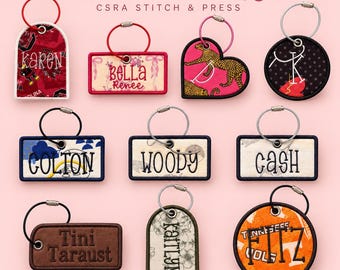 May include: A collection of custom bag tags with various shapes including rectangles, circles, and hearts, featuring embroidered names like Karen, Bella Renee, Colton, Woody, Cash, Tini Taraust, Kaitlyn, and Fitz, each attached to a metal ring.