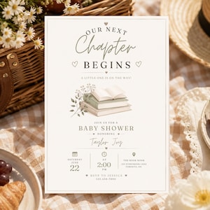 May include: A rectangular baby shower invitation card featuring the text Our Next Chapter Begins and A Little One Is On The Way. The design includes an illustration of stacked books with foliage, event details for Taylor Joy, and date and time info.