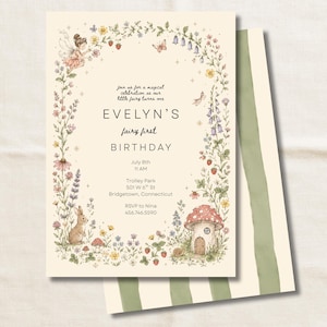 May include: A cream-colored birthday invitation card featuring a floral border with a fairy, a rabbit, and a mushroom house. The text reads: Join us for a magical celebration as our little fairy turns one, EVELYN'S fairy first BIRTHDAY, July 8th, 11 AM, Trolley Park, 501 W 6th St, Bridgetown, Connecticut, RSVP to Nina, 456.746.5590.