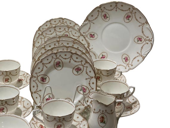 Vintage Royal Doulton Pink Rose Tea Set: 20-piece Floral Porcelain for Weddings and Nostalgia