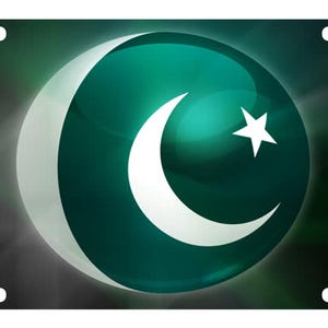 May include: A rectangular license plate featuring a glossy, dark green circular emblem in the center. The emblem displays a white crescent moon and a five-pointed star. The background of the plate is a dark, abstract gradient with light rays.