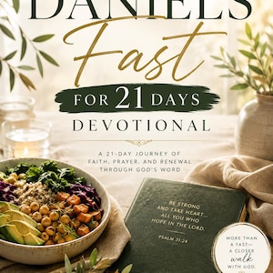 May include: A book titled Daniel's Fast for 21 Days Devotional with a dark green cover featuring Psalm 31:24 text. The cover displays the words Seek Him. Draw Near. Transform Your Heart. and includes a bowl of salad with avocado, chickpeas, and greens.