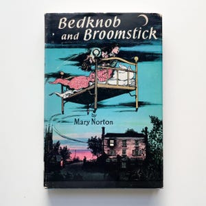 May include: Vintage hardcover book titled "Bedknob and Broomstick" by Mary Norton. The cover features an illustration of a bed floating in the sky with two children. The background is a teal color with a crescent moon and a house.