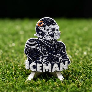 May include: A navy blue and white embroidered patch featuring a football player wearing a helmet with an orange C logo. The player has arms crossed, and the word ICEMAN is stitched in white capital letters across the bottom of the patch.