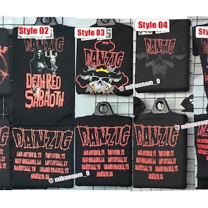 May include: A collection of black t-shirts featuring various Danzig-themed graphic prints in red and white. The designs include text such as Killer Wolf Krew, Deth Red Sabaoth, and a list of cities including San Antonio, Houston, New Orleans, and Louisville.