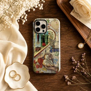 May include: A smartphone case featuring a collage of vintage-style illustrations, including a figure in a long dress, a rabbit, hands holding an open book, and botanical elements, all set against a background of aged, printed text.