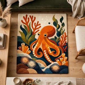 May include: A rectangular area rug featuring a central orange octopus surrounded by deep blue water, orange coral, green seaweed, and spiky sea urchins. The design includes light-coloured sandy textures at the bottom and small bubbles above.