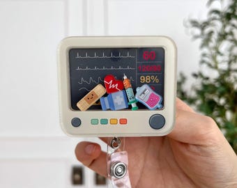 Portatarjetas con agitador para monitor cardíaco: divertido clip para credencial de enfermera de electrocardiograma