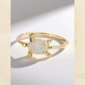 Gold Tone Opal Ring with Sculptural Claw Setting