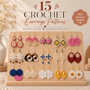 May include: A wooden display stand holding 15 pairs of assorted crochet earrings in various shapes and colors, including floral, geometric, and circular designs. The text reads 15 CROCHET Earrings Patterns PDF Pattern Bundle.