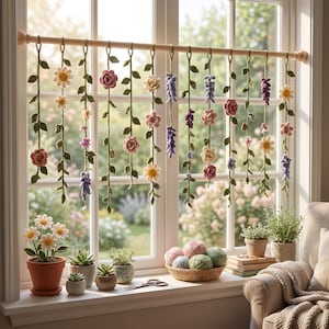 May include: A window curtain featuring multiple hanging crochet flower vines in various colors including pink, yellow, purple, and white, suspended from a wooden rod. The vines display green leaves and diverse floral shapes, creating a decorative display.