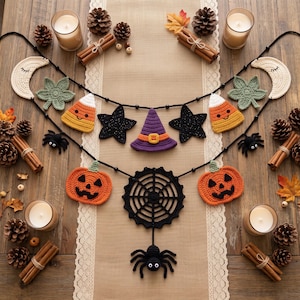 May include: A two-tiered crochet Halloween garland featuring cream-colored moons, green leaves, candy corn, black stars, a purple witch hat, orange jack-o'-lanterns, a black spider web, and a black spider, all strung on a black cord with beads.