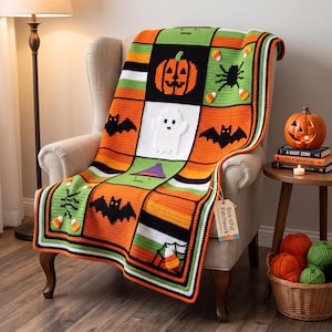 May include: A rectangular crochet blanket featuring a patchwork design with orange, green, white, and black yarn. The pattern includes motifs of a jack-o'-lantern, a white ghost, black bats, and candy corn. A tag attached to the blanket reads Boo-tiful Patchwork.
