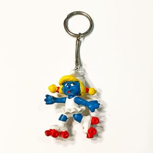 Vintage 1980 Peyo Smurfs Rollerskating Smurfette PVC Plastic Figure Keychain