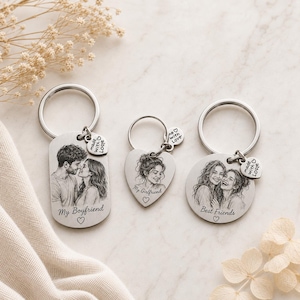 May include: Three silver-toned metal keychains with engraved portraits. The rectangular one says My Boyfriend, the heart-shaped one says My Girlfriend, and the circular one says Best Friends. Each includes a small heart charm labelled Made with Love.