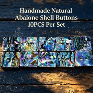 May include: A set of 10 square abalone shell buttons featuring iridescent blue, green, and purple patterns. Each button has two holes in the center. The text "Handmade Natural Abalone Shell Buttons 10PCS Per Set" is printed above the buttons.