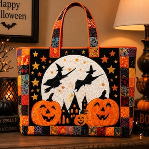 May include: A quilted tote bag featuring a Halloween scene with two orange jack-o'-lanterns, a large white full moon, and black silhouettes of two flying witches and a house. The bag has a patchwork border of orange, black, and patterned fabric.