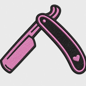 May include: An embroidered patch shaped like a straight razor with a black handle and a pink blade. The handle features a small pink heart near the bottom, and the entire design is outlined in thick black thread, creating a bold, graphic appearance.