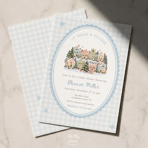 Puede incluir: Una tarjeta de invitación para baby shower con fondo de cuadros vichy azul claro y pequeños copos de nieve. El centro muestra una ilustración de un pueblo invernal dentro de un marco ovalado festoneado con el texto IT TAKES A VILLAGE y detalles.