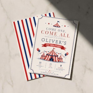 May include: A cream-colored invitation card with red and blue circus-themed graphics, featuring a large tent illustration and the text "COME ONE, COME ALL" and "OLIVER'S 1ST BIRTHDAY". It is paired with a matching envelope featuring red and blue stripes.