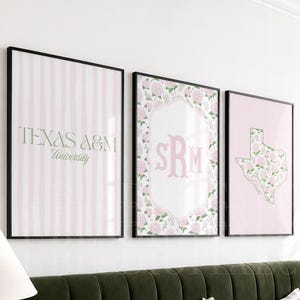 May include: Three framed wall art prints featuring a light pink and white striped background with the text Texas A&M University, a central monogram with pink floral borders, and a pink outline of the state of Texas filled with floral patterns.