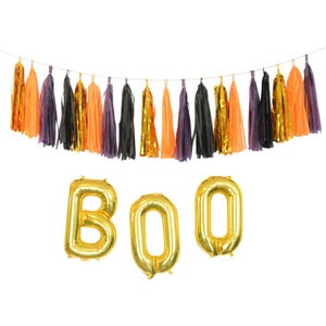 Dolcetto o scherzetto, decorazioni chic per Halloween in oro, nero, prugna e arancione
