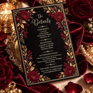 May include: A black wedding invitation card featuring gold floral borders and deep red roses. The text reads: The Details, Ceremony 6:30 PM, Velvet Manor, 18 Rosemont Terrace, Charleston, SC, Reception, Cocktails at 7:00 PM, Dinner at 8:00 PM, Dancing to follow.