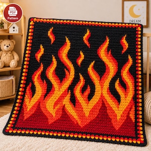 May include: A square crochet blanket featuring a black background with a central flame pattern in shades of red, orange, and yellow. The blanket is finished with a decorative border of alternating red and yellow squares against a black frame.