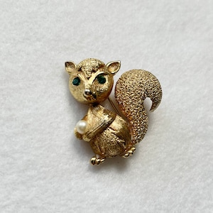 Gold Tone Fluffy Squirrel Holding a Faux Pearl Brooch