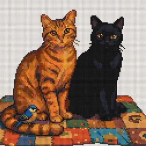 May include: A cross-stitch pattern featuring an orange tabby cat and a solid black cat sitting side-by-side on a colorful patchwork quilt. A small blue bird is perched near the tail of the orange cat, all rendered in a pixelated grid style.