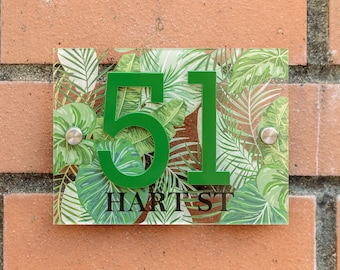 May include: A green house number sign with the number 51 and the text "HART ST" on a white background with a tropical leaf pattern.
