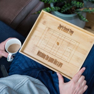 May include: A personalized wooden snack tray with a rugby field design and the text "Jay's Snack Tray Watching the game like a pro".