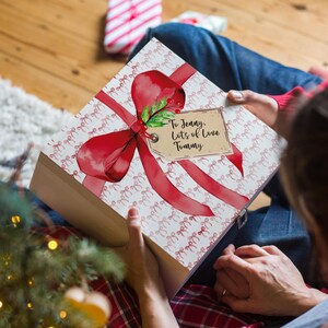 Personalised Wooden Christmas Eve Gift Box With Red Bow And Personalised Tag
