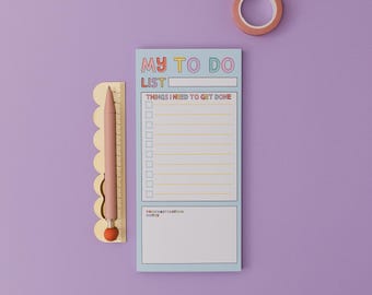 May include: A blue to-do list notepad with the words "My To Do List" in rainbow colors. The notepad has a section for "Things I Need To Get Done" with a checklist and a section for "Procrastination Notes".