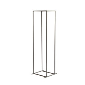 Minimalist tall black metal firewood rack frame with square base, photographed on white background, Scandinavian indoor log holder design.